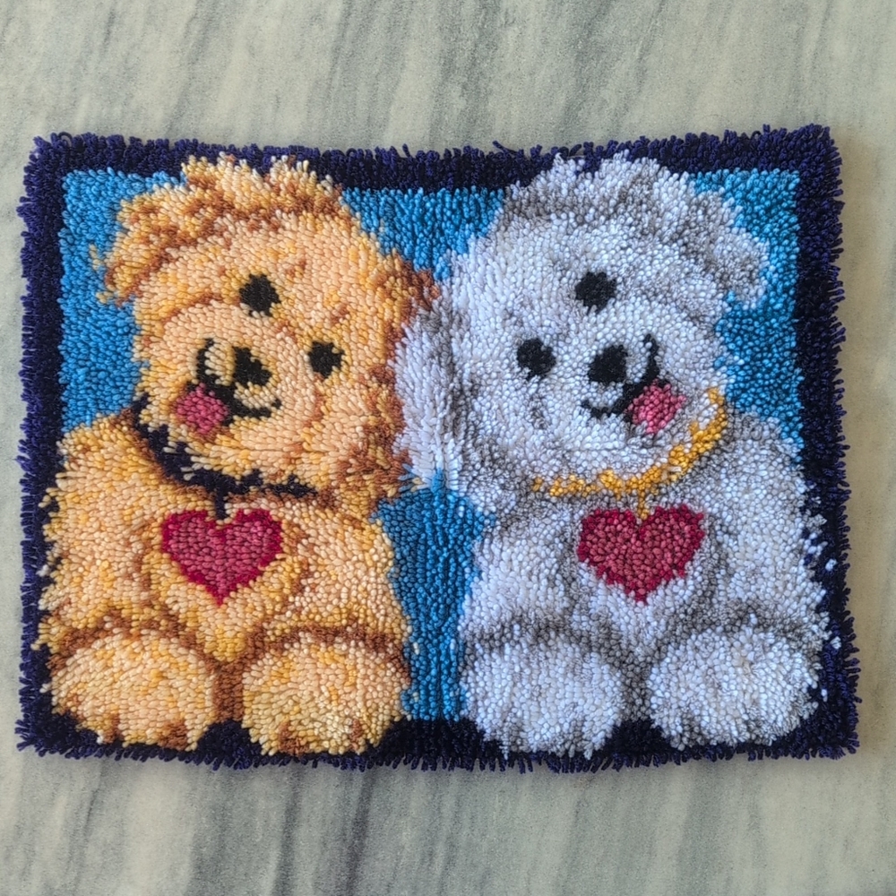 NWOT. A adorable handmade latch hook rug features two shaggy puppies with heart.